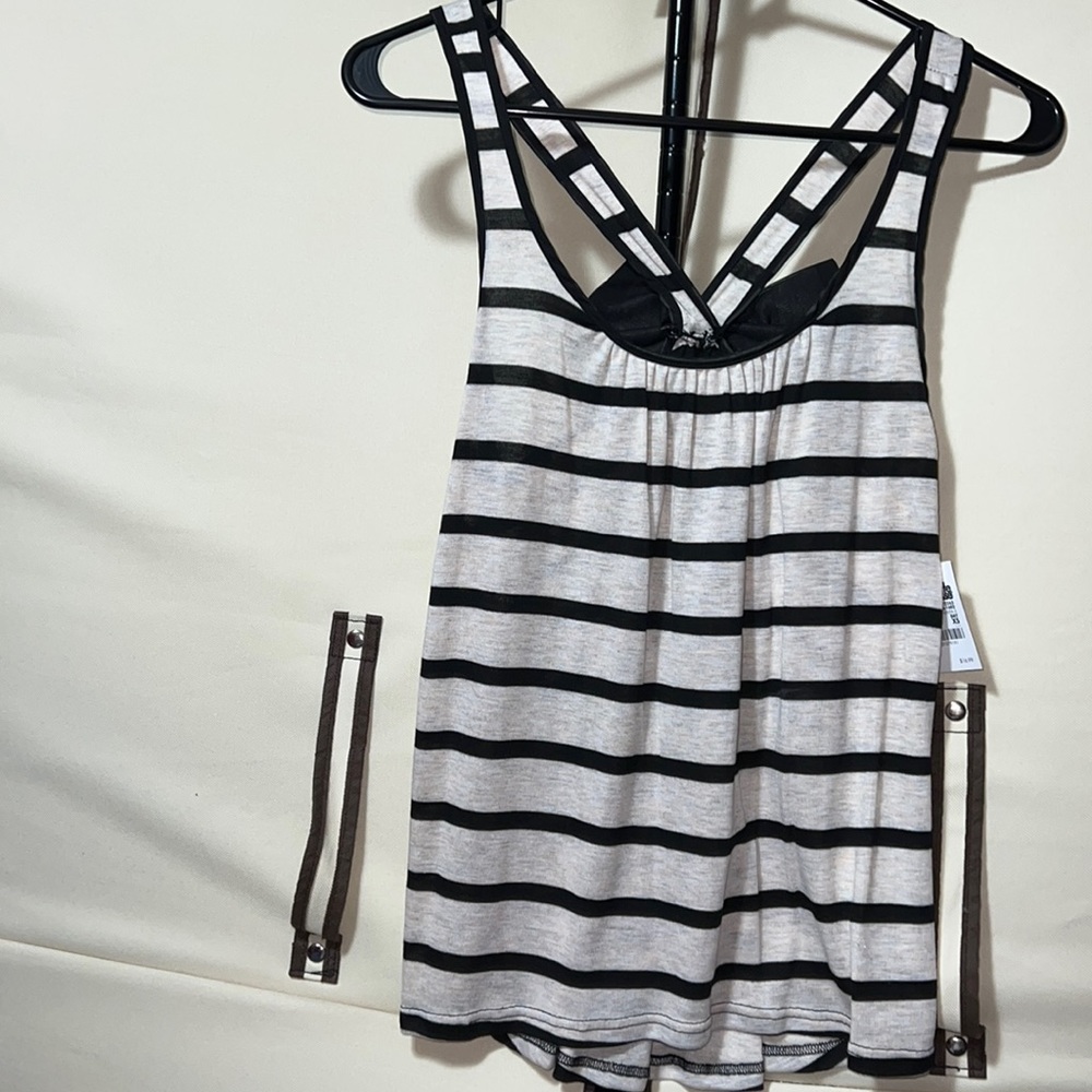 Woman’s flowy cream with black stripe sleeveless top